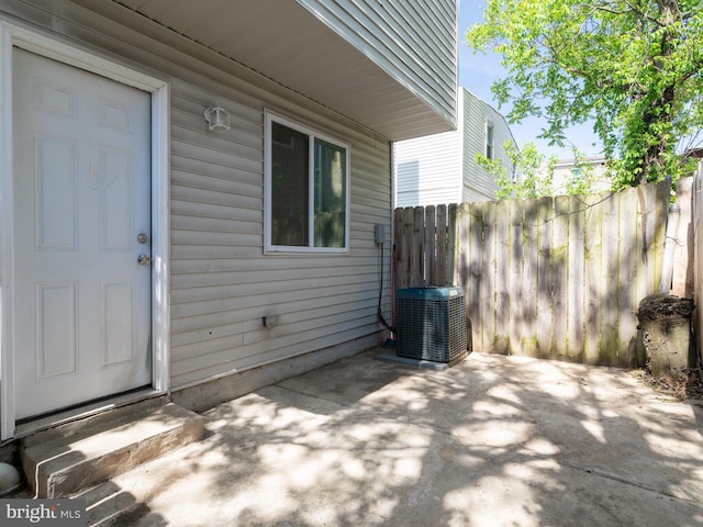 2671 Emerald St, Philadelphia, PA 19125 - view of exterior entry with central AC unit, a patio area, and fence