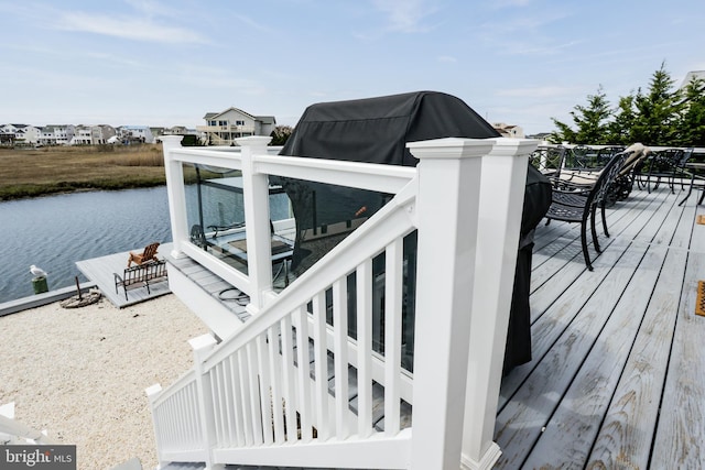 deck featuring a water view