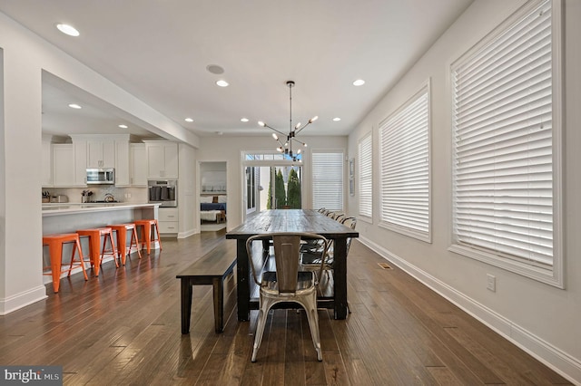 dining area featuring baseboards, a chandelier, recessed lighting, and dark wood-style flooring