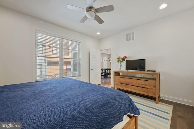 bedroom with wood finished floors, baseboards, visible vents, ceiling fan, and recessed lighting