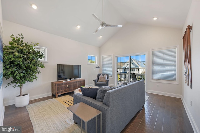 living area with high vaulted ceiling, baseboards, dark wood-style floors, visible vents, and ceiling fan