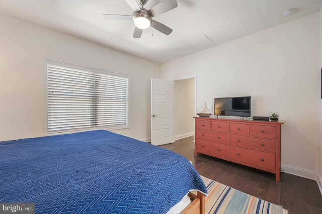 bedroom with baseboards, wood finished floors, and ceiling fan