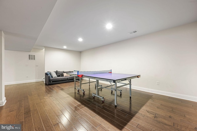 rec room featuring recessed lighting, hardwood / wood-style flooring, baseboards, and visible vents