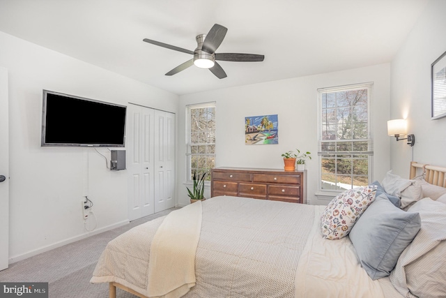 219 Hitching Post Dr, Bel Air, MD 21014 - carpeted bedroom featuring multiple windows, a closet, baseboards, and a ceiling fan