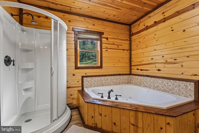 full bath with a jetted tub, a stall shower, wooden walls, and wooden ceiling