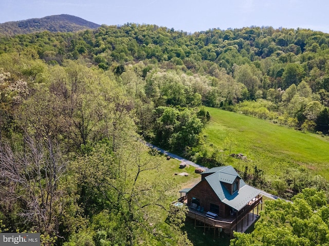 drone / aerial view featuring a view of trees