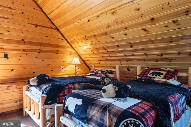 bedroom featuring wood walls, wooden ceiling, and wood finished floors