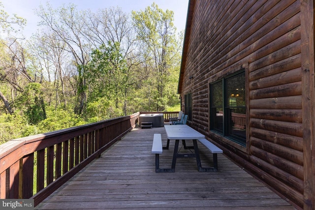 deck featuring outdoor dining area and central AC