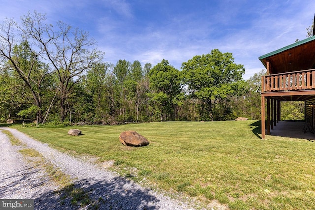 view of yard with a wooden deck