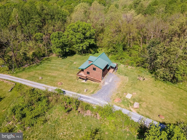 bird's eye view featuring a wooded view