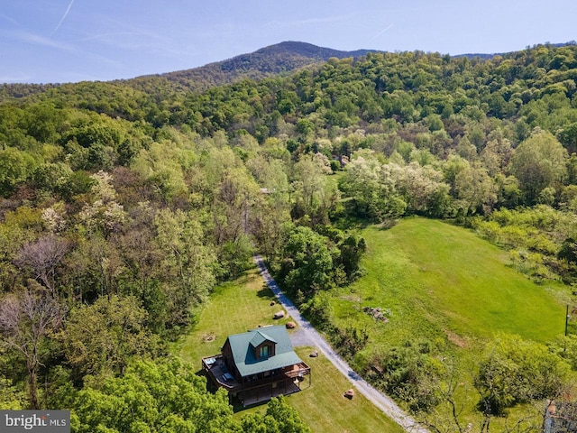 aerial view featuring a wooded view