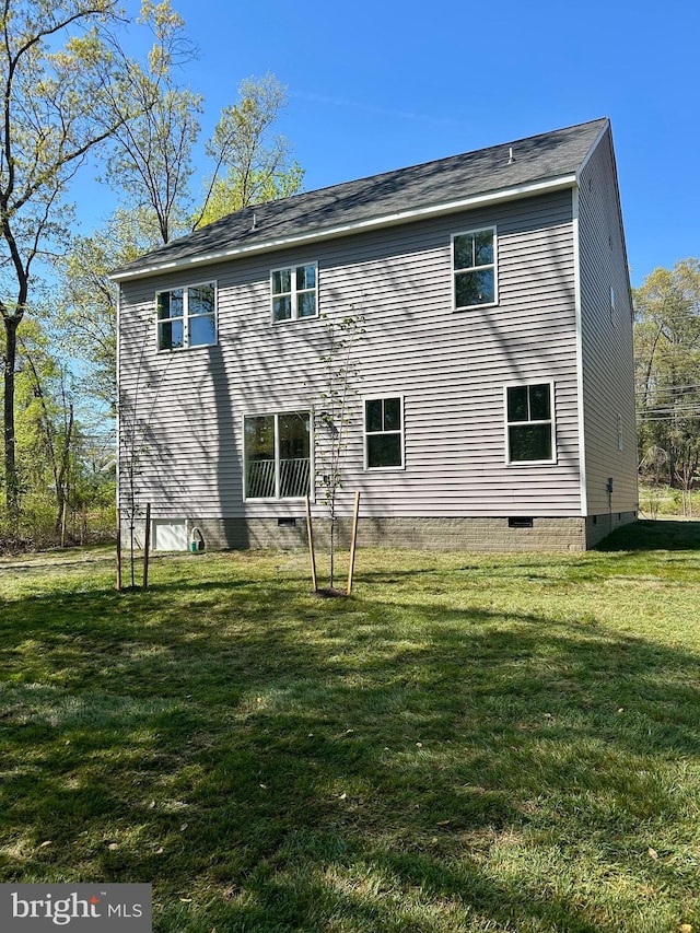 4655 Mountain Rd, Pasadena, MD 21122 - rear view of house featuring crawl space and a lawn