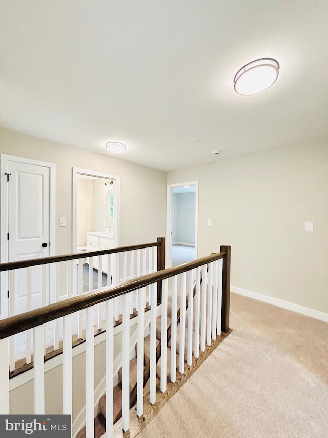 4655 Mountain Rd, Pasadena, MD 21122 - hall with an upstairs landing, light carpet, and baseboards