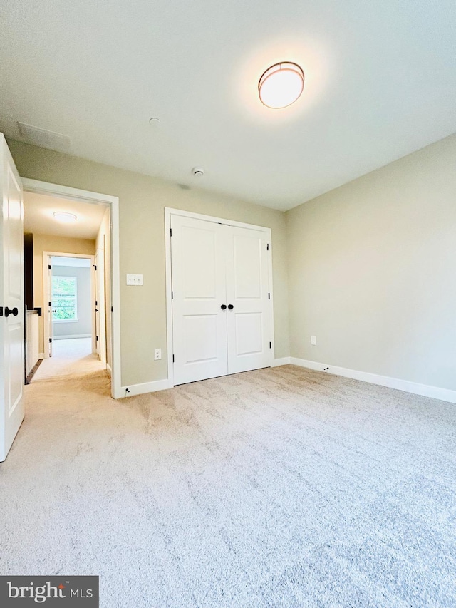 4655 Mountain Rd, Pasadena, MD 21122 - unfurnished bedroom featuring carpet, baseboards, and a closet