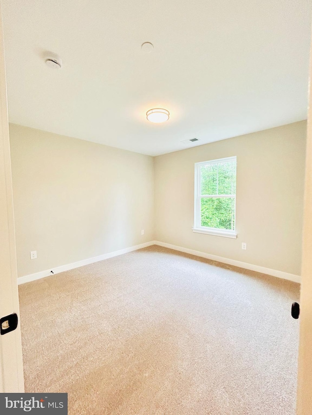 4655 Mountain Rd, Pasadena, MD 21122 - empty room featuring carpet, baseboards, and a smoke detector