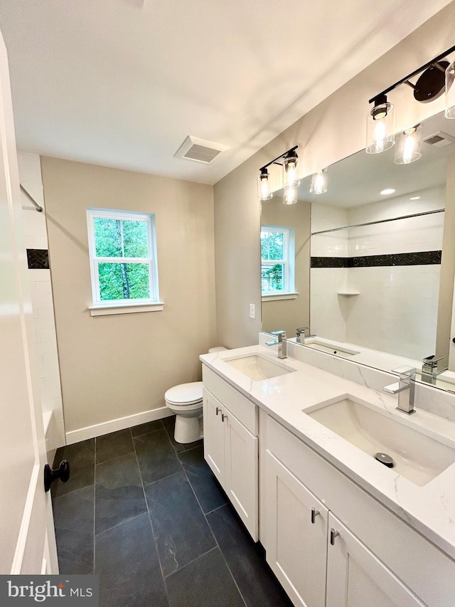 4655 Mountain Rd, Pasadena, MD 21122 - full bathroom with plenty of natural light, toilet, baseboards, and double vanity