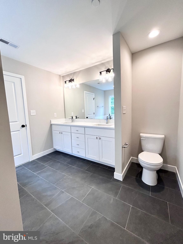 4655 Mountain Rd, Pasadena, MD 21122 - bathroom with tile patterned flooring, baseboards, double vanity, and toilet