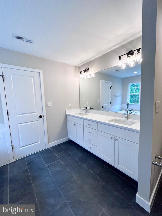 4655 Mountain Rd, Pasadena, MD 21122 - bathroom featuring double vanity, tile patterned floors, and baseboards