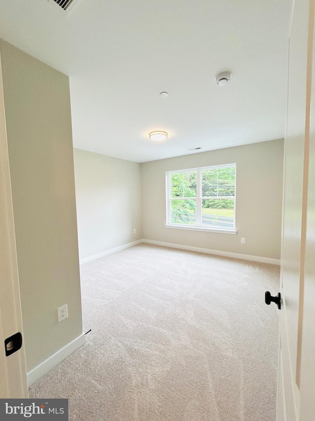 4655 Mountain Rd, Pasadena, MD 21122 - carpeted spare room featuring baseboards and a smoke detector