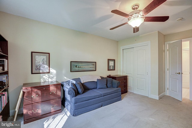 living area featuring carpet floors, ceiling fan, and baseboards