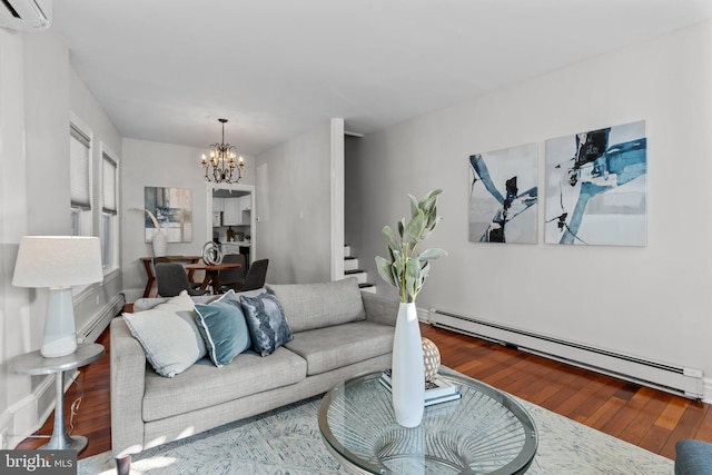 living room featuring wood finished floors, an AC wall unit, a chandelier, and a baseboard radiator
