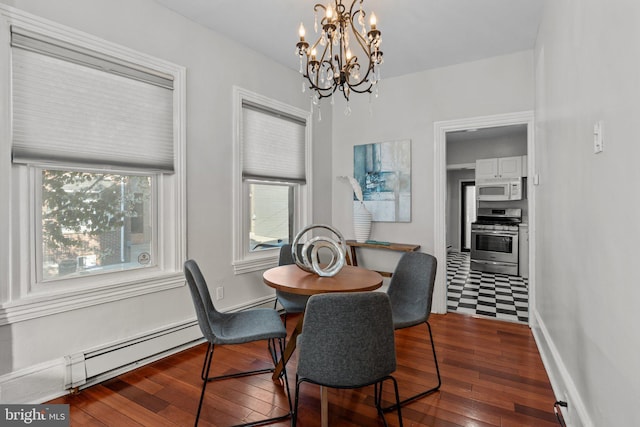 dining room with a baseboard radiator, a chandelier, wood-type flooring, and baseboards