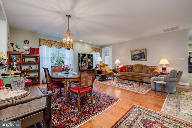617 Redbud Ln, Woodstock, VA 22664 - dining space with visible vents, a chandelier, and wood finished floors