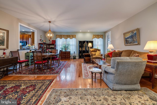 617 Redbud Ln, Woodstock, VA 22664 - living area with a notable chandelier and hardwood / wood-style flooring