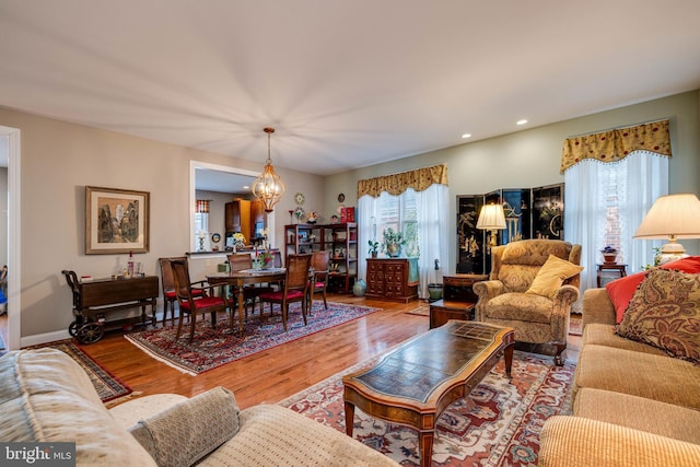 617 Redbud Ln, Woodstock, VA 22664 - living room with recessed lighting, baseboards, a chandelier, and wood finished floors