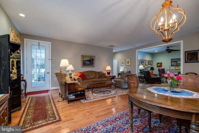 617 Redbud Ln, Woodstock, VA 22664 - living area featuring visible vents, light wood-style flooring, recessed lighting, and ceiling fan with notable chandelier