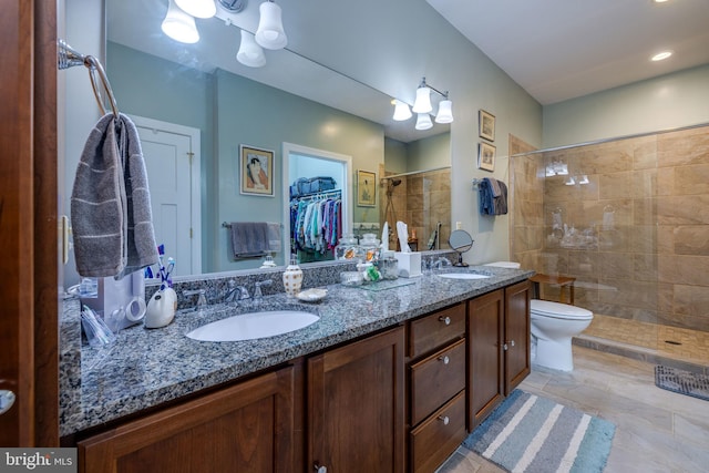 617 Redbud Ln, Woodstock, VA 22664 - bathroom featuring double vanity, a sink, a walk in closet, and a shower stall