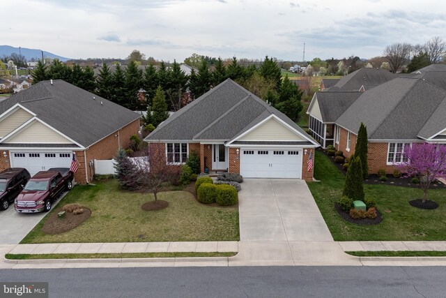 617 Redbud Ln, Woodstock, VA 22664 - view of front of property featuring brick siding, a garage, concrete driveway, and a front yard