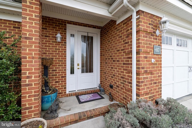 617 Redbud Ln, Woodstock, VA 22664 - doorway to property with brick siding and an attached garage