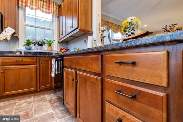 617 Redbud Ln, Woodstock, VA 22664 - kitchen featuring a wealth of natural light, brown cabinets, and dark stone countertops