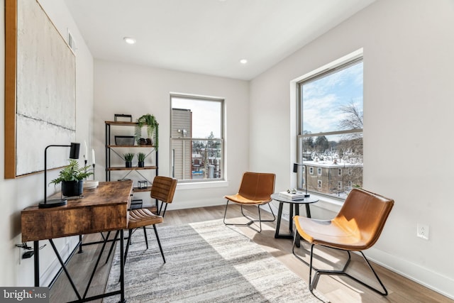 office with recessed lighting, wood finished floors, and baseboards