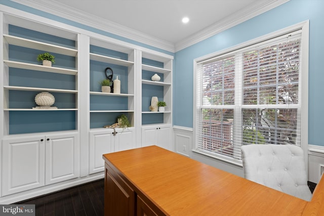 office area featuring crown molding, dark wood-type flooring, wainscoting, and built in shelves
