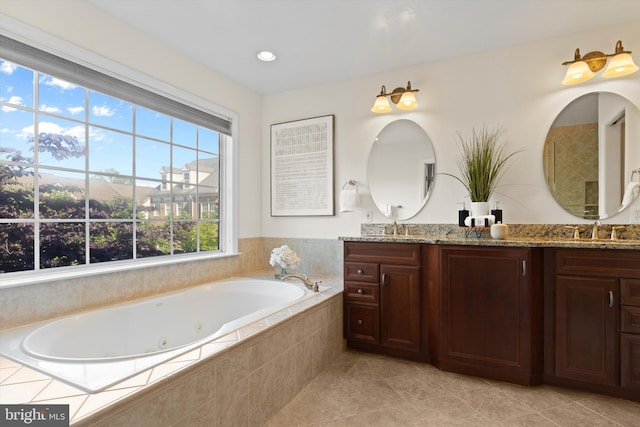full bathroom featuring tile patterned flooring, a jetted tub, and double vanity