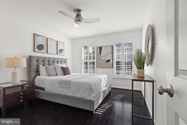 bedroom featuring dark wood finished floors, baseboards, and a ceiling fan