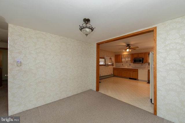 unfurnished living room featuring a baseboard heating unit, ceiling fan, light floors, and wallpapered walls