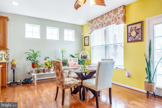 dining room featuring light wood-style flooring, recessed lighting, ceiling fan, and baseboards