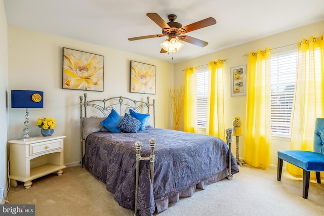 bedroom with baseboards, a ceiling fan, and carpet floors