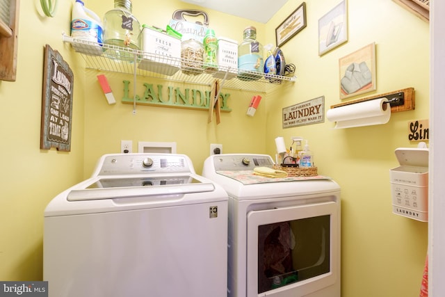 laundry area featuring washer and dryer and laundry area