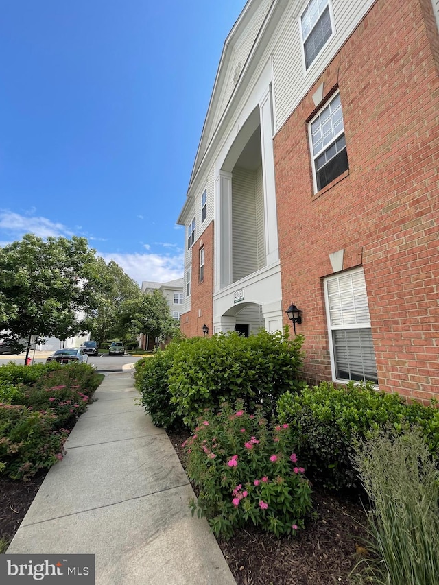42480 Rockrose Sq Unit 202, Brambleton, VA 20148 - view of side of home with brick siding