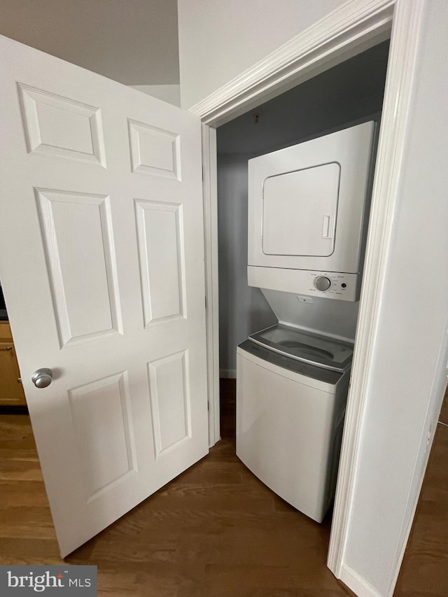42480 Rockrose Sq Unit 202, Brambleton, VA 20148 - washroom featuring stacked washer and clothes dryer and dark wood finished floors