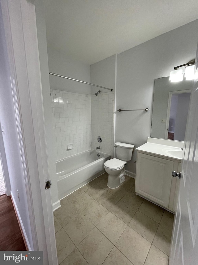 42480 Rockrose Sq Unit 202, Brambleton, VA 20148 - bathroom featuring vanity, toilet,  shower combination, tile patterned flooring, and baseboards