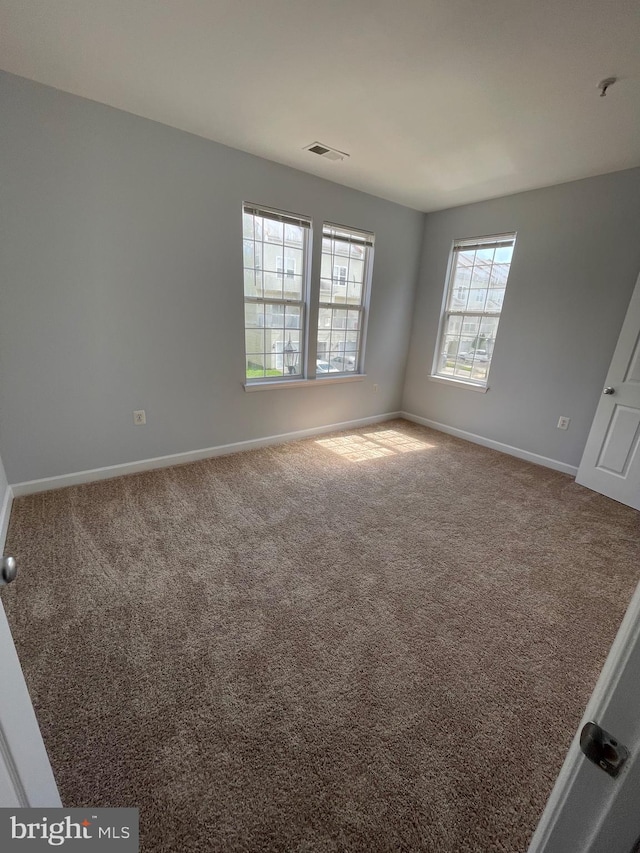 42480 Rockrose Sq Unit 202, Brambleton, VA 20148 - carpeted spare room with baseboards