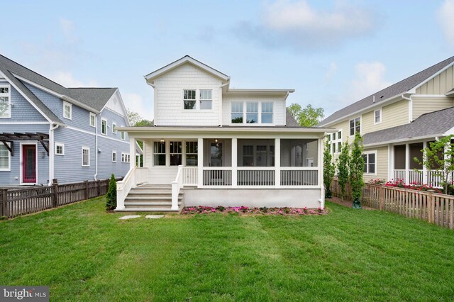back of property with a sunroom