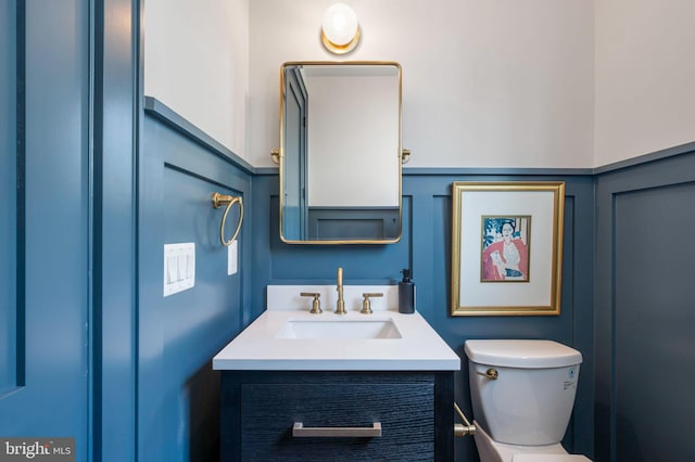 half bath with vanity and toilet