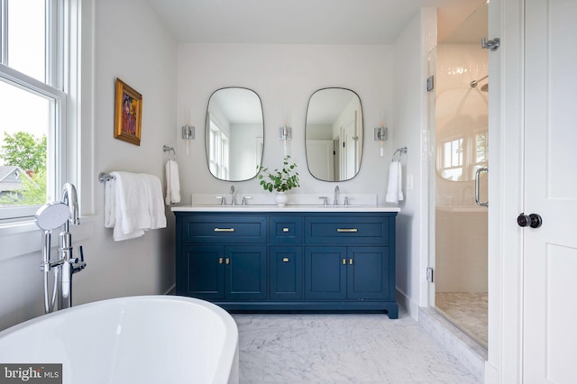 full bath featuring a freestanding bath, a shower stall, double vanity, and marble look tiles