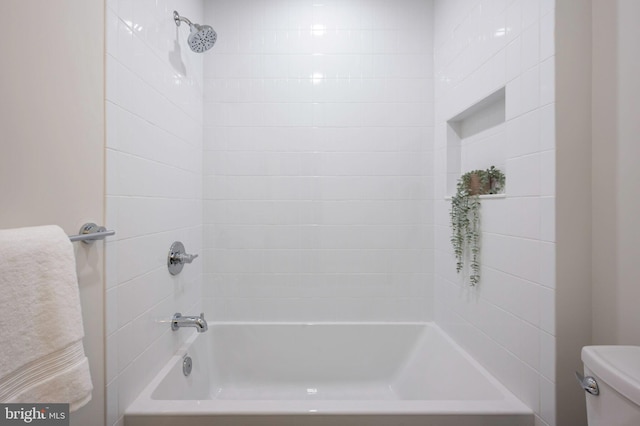 bathroom featuring toilet and shower / tub combination